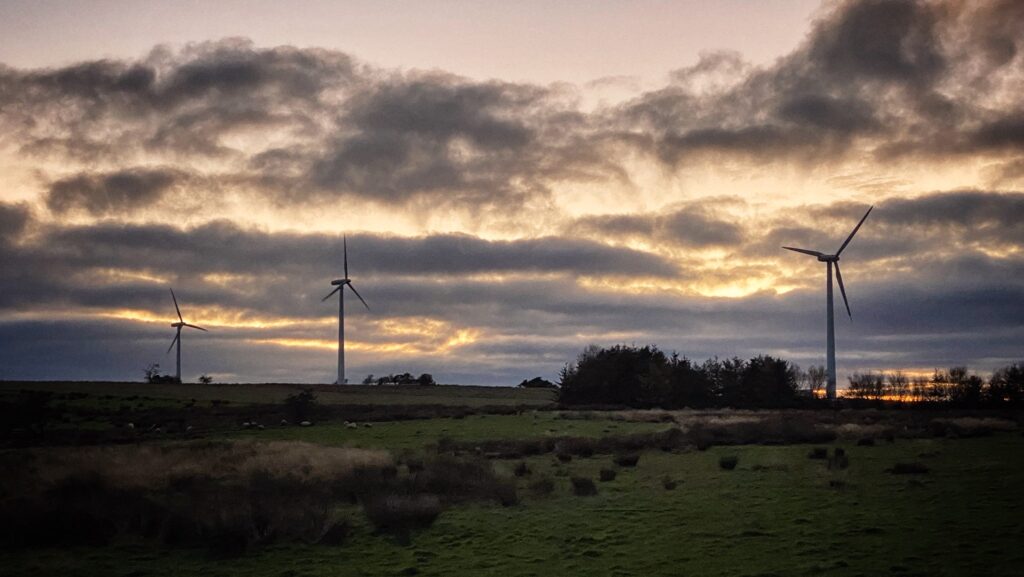 A trinity of wind turbines at Kirkheaton in Northumberland set against a brooding dusky sky in the winter of 2021
